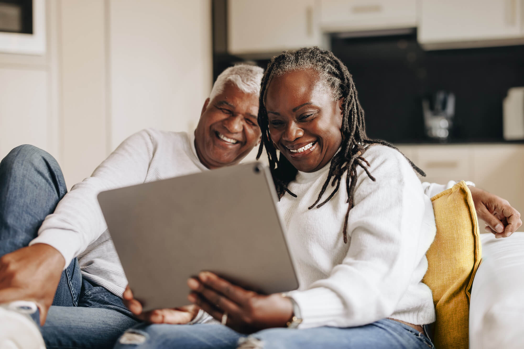 older couple using senior living technology solutions