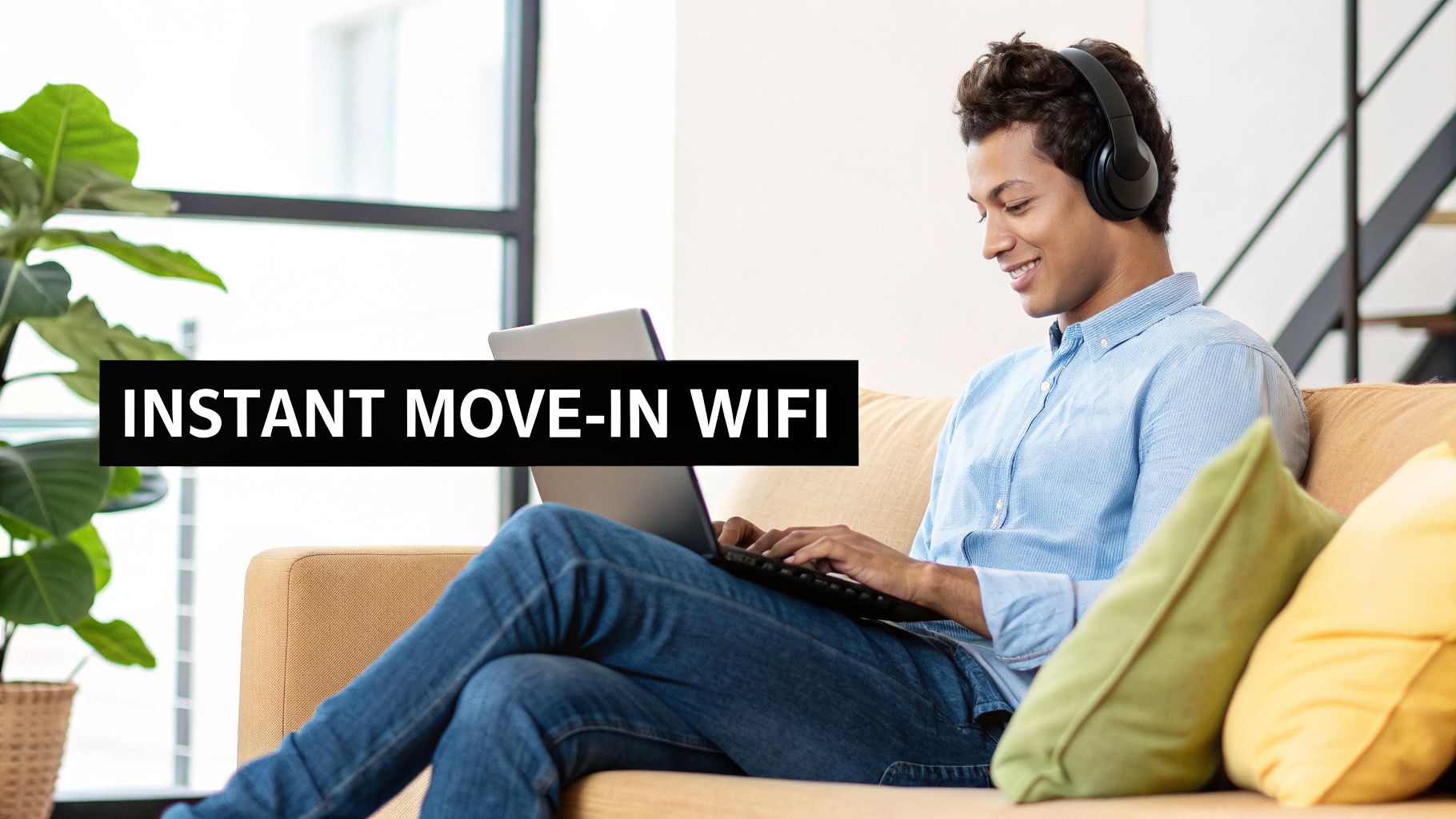A smiling young man with headphones uses a laptop on a sofa, with text 'INSTANT MOVE-IN WIFI'.